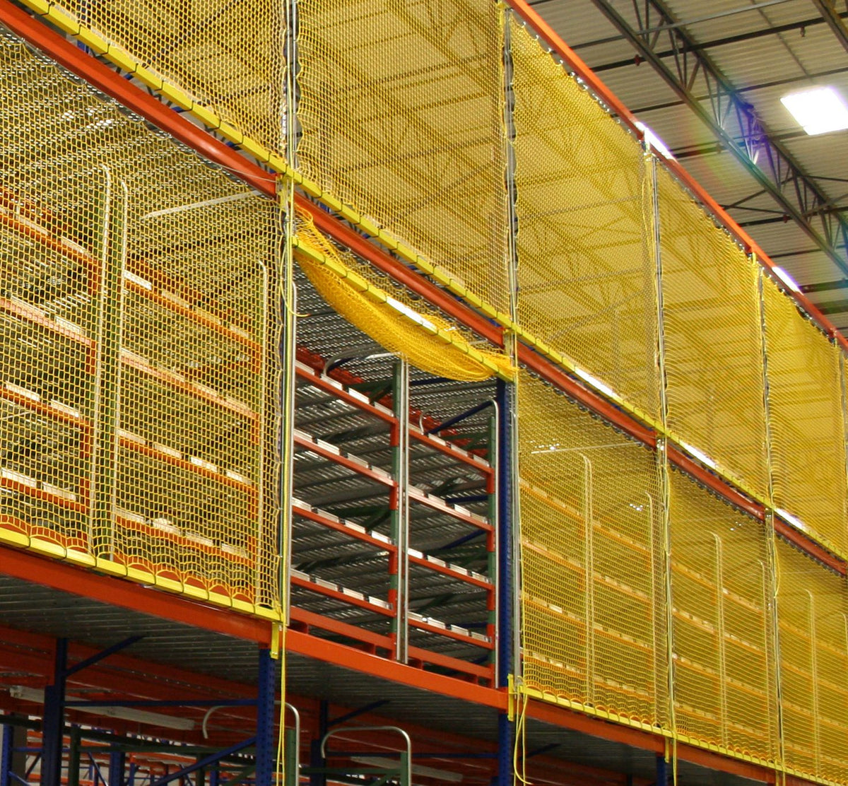 Yellow elevating rack safety netting with one bay open for material access